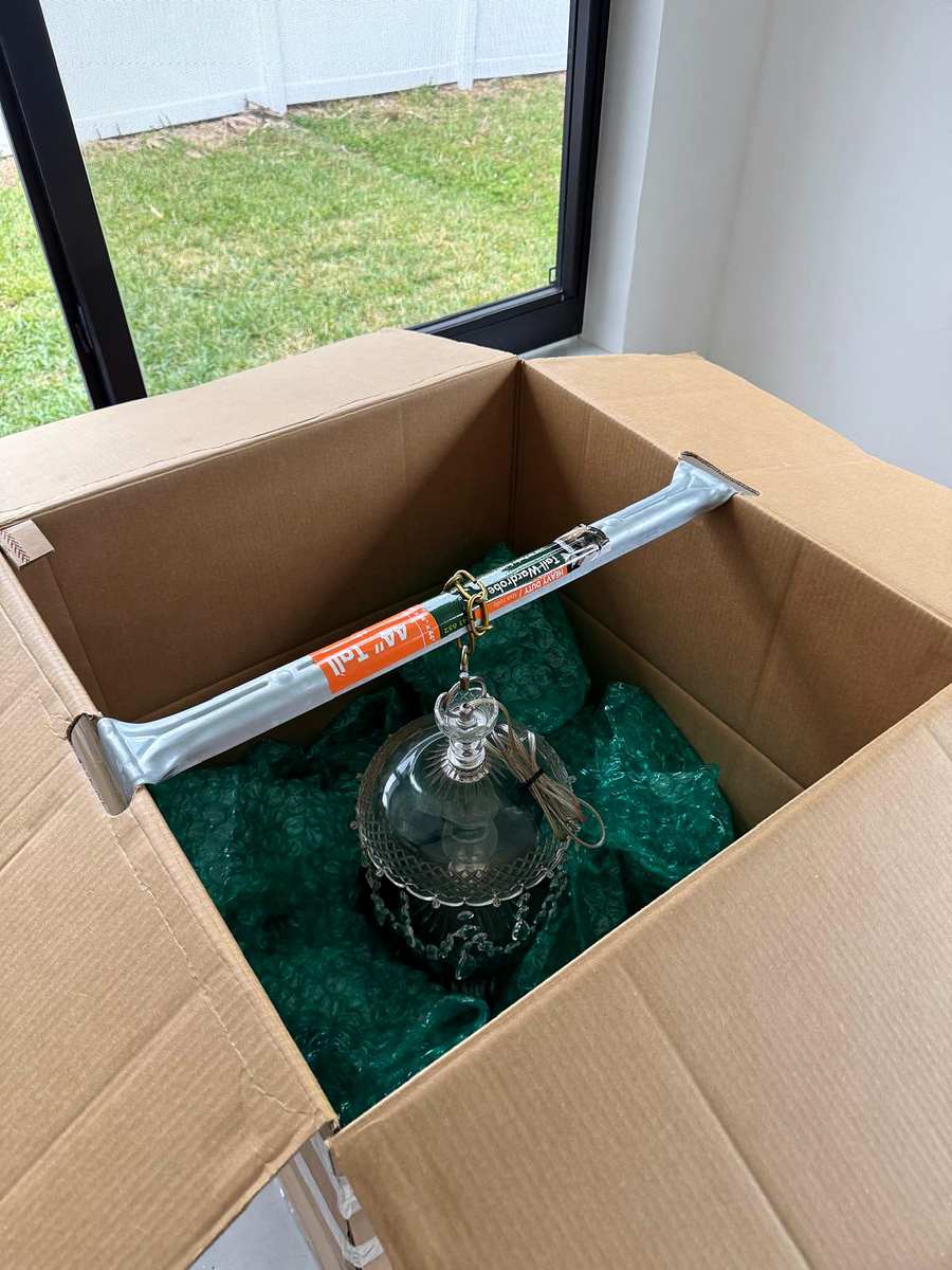 Glass chandelier still in its shipping box